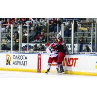 Allen Americans defenseman Ryan Gagnon (right) vs. the Rapid City Rush