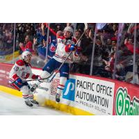 Spokane Chiefs left wing Shea Van Olm and defenseman Saige Weinstein (right) celebrate