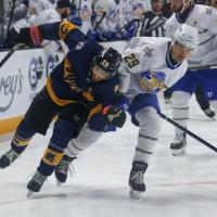 Knoxville Ice Bears' Eric Olson and Roanoke Rail Yard Dawgs' Brendan Pepe in action