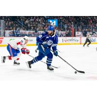 Laval Rocket's Rafaël Harvey-Pinard and Syracuse Crunch's Joel Teasdale in action