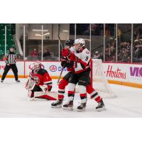 Belleville Senators left wing Angus Crookshank battles for position against the Utica Comets